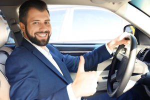 young man on driver's seat of car